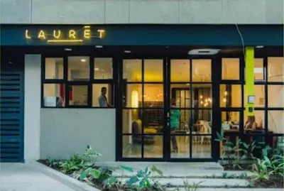 a store front of a building with a sign that reads lunch at Cozy Studio 703 Heart of Laureles in Medellín