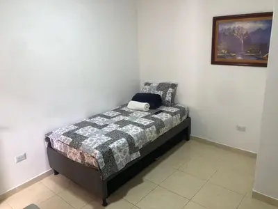 a small bedroom with a bed in a room at Individual studio apartment 2 in Medellín