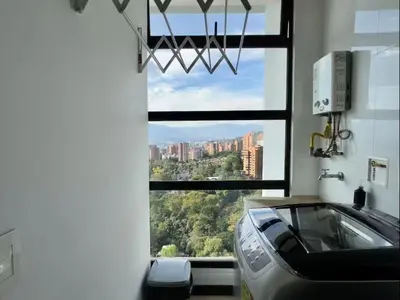 a room with a car in front of a window at 2003 Poblado TOP apartamento in Medellín