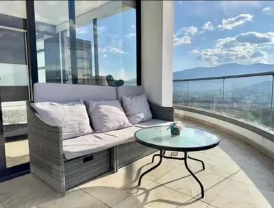 a living room with a couch and a table at 2003 Poblado TOP apartamento in Medellín