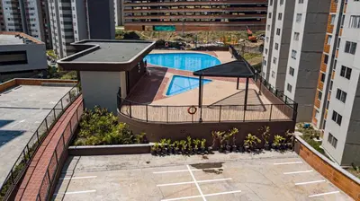 an overhead view of a building with a swimming pool at Espectacular Habitacion Privada en Apartamento in Medellín