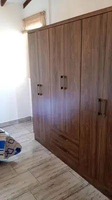 a large wooden cabinet in the middle of a room at Rural Cabin Among Clouds in Támesis