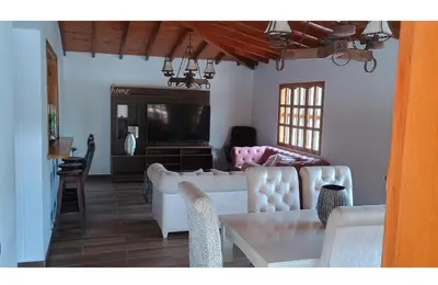 a living room with a couch and a table at Villa marinilla in Santuario