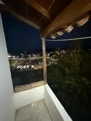 a window view of a parking lot at night at Casa Village in Guatapé