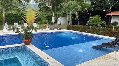 a large blue swimming pool in a yard at Villa with pool, jacuzzi, Turkish bath, BBQ, kiosk, and green area in Sopetran