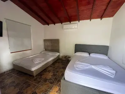 two twin beds in a room with at Villa with pool, jacuzzi, Turkish bath, BBQ, kiosk, and green area in Sopetran