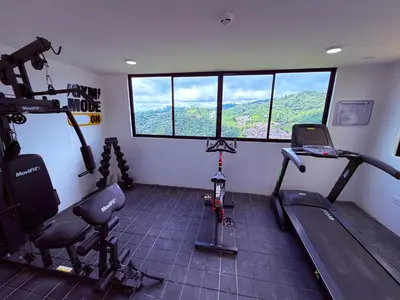 a gym with two treadmills and a treadmill at Nuevo apartamento moderno, espectacular vista in Manizales