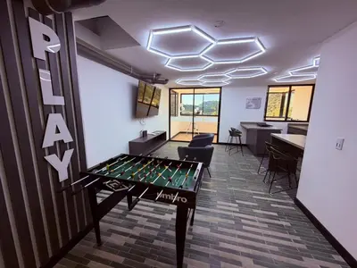 an office with a ping pong table in a room at Nuevo apartamento moderno, espectacular vista in Manizales