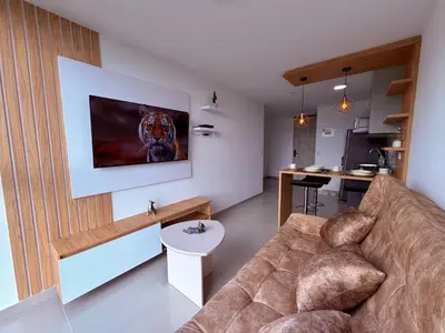 a living room with a couch and a table at Nuevo apartamento moderno, espectacular vista in Manizales