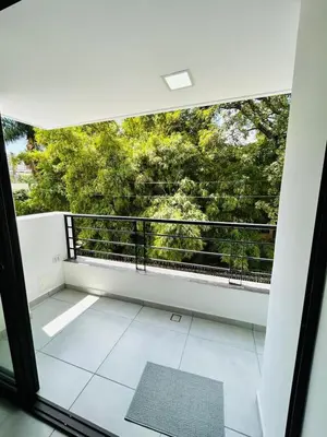 a room with a balcony with a view of trees at Central apartment in Bello in Bello