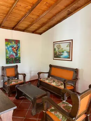 a room with three chairs and a table and a couch at Ranch Style Home Jardin Del Eden in Verdún