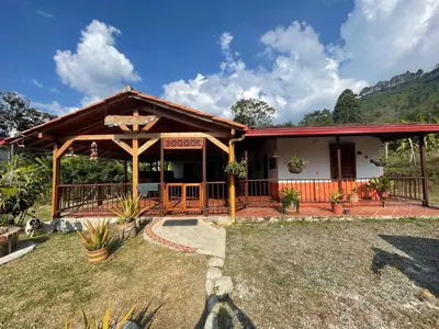a small house with a porch and a fence at Ranch Style Home Jardin Del Eden in Verdún