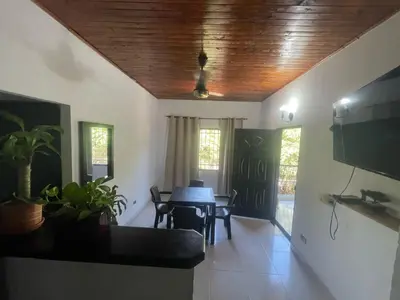 a dining room with a table and some chairs at Hospedaje LunaDorada en Doradal in Puerto Triunfo