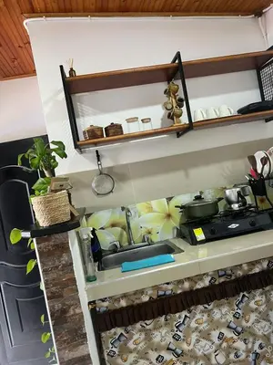 a kitchen with a sink and a stove at Hospedaje LunaDorada en Doradal in Puerto Triunfo