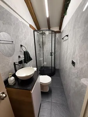 a bathroom with a shower and a toilet and a sink at Apartamento tipo loft in Guarne