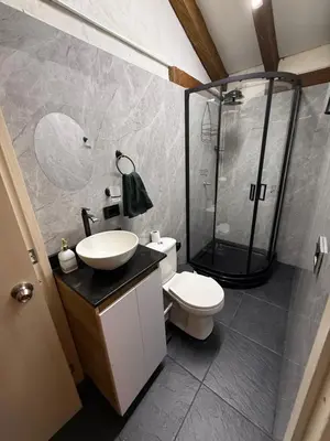 a bathroom with a shower and a toilet and a sink at Apartamento tipo loft in Guarne