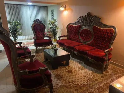 a living room with a couch and two chairs at Casa Primaveral Espaciosa Cerca al Estadio in Medellín