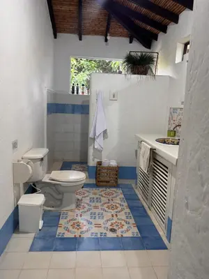 a bathroom with a toilet and a sink at San José del refugio in Jericó