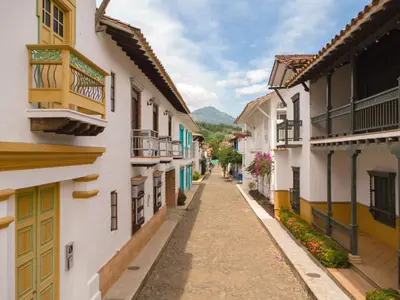 an empty street in a town with buildings at San José del refugio in Jericó