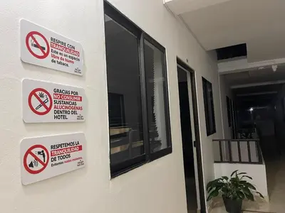 a building with signs on the side of it at Hotel Real Alejandria in Alejandría