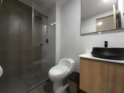 a bathroom with a toilet and a sink and a shower at MEDELLIN ALOJAMIENTO EN Laureles in Medellín