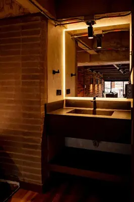 a bathroom with a sink and a mirror at Uukam by Bernalo Hotels in Medellín