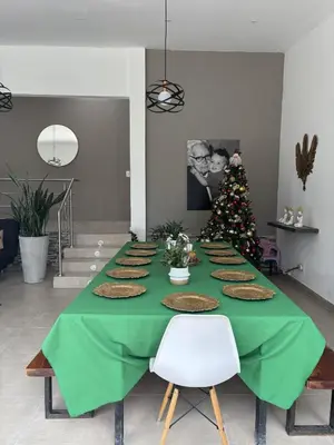 a green table with a christmas tree on it at Casa Campestre con Piscina in Manizales