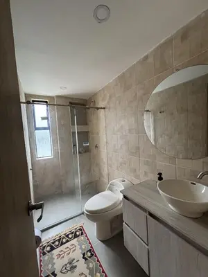 a bathroom with a toilet and a sink and a shower at Casa Campestre con Piscina in Manizales
