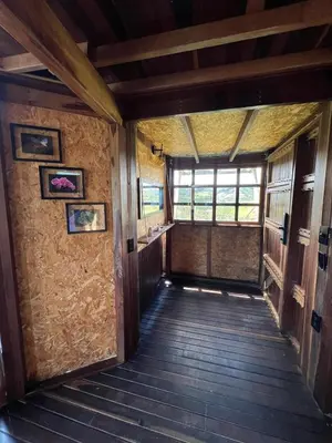 an empty hallway of a house with a window at Ikuna Luxury Glamping 1h from Medellin with Private Jacuzzi in San Vicente