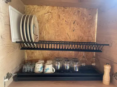 a shelf with mason jars in a kitchen at Ikuna Luxury Glamping 1h from Medellin with Private Jacuzzi in San Vicente