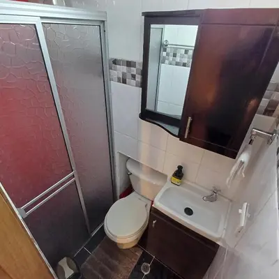 a bathroom with a toilet and a sink and a shower at El Mejor Aparta Estudio De La Ciudad in Manizales