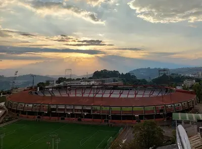 a large soccer stadium with a green field at El Mejor Aparta Estudio De La Ciudad in Manizales