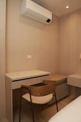 a small room with a desk and a chair at VPV Suites & Casino in Medellín