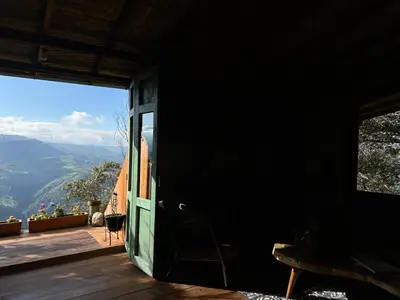 a door to a room with a view of the mountains at Alto Bonito Cabin Salamina in Salamina