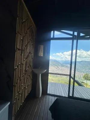 a room with a window with a sink and a view at SKY Glamping San Félix in Bello