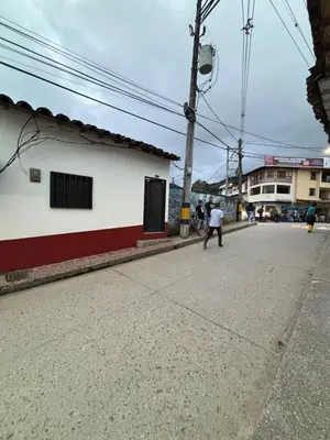 a group of people walking down a street at Hospedaje Doña Blanca in Concepción