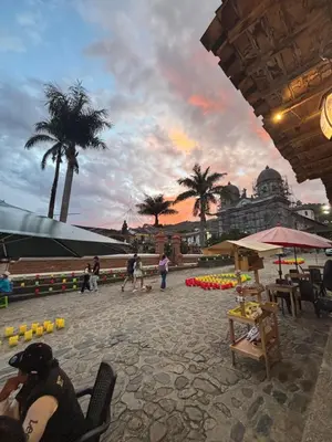 a group of people sitting in chairs on a beach at Hospedaje Doña Blanca 2 in Concepción