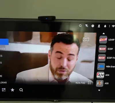 a picture of a man on a television screen at Happy house in Medellín