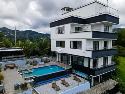 an aerial view of a house with a swimming pool at The Palms Hotel in Estación El Salto