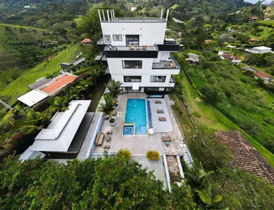 an aerial view of a house with a swimming pool at The Palms Hotel in Estación El Salto