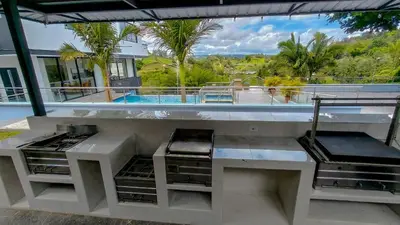 a balcony with a view of a swimming pool at The Palms Hotel in Estación El Salto