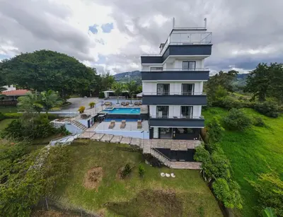an aerial view of a building with a swimming pool at The Palms Hotel in Estación El Salto