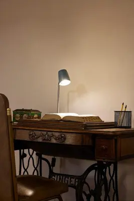 a desk with a lamp and a book on it at El Poblado Medellin Luxury 5BR Jacuzzi AC in Medellín
