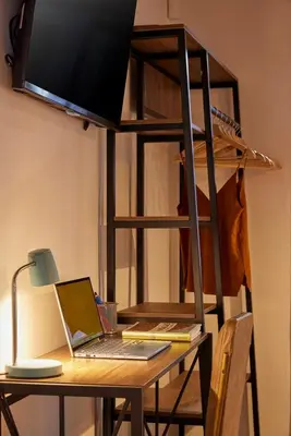 a desk with a laptop and a bunk bed at El Poblado Medellin Luxury 5BR Jacuzzi AC in Medellín