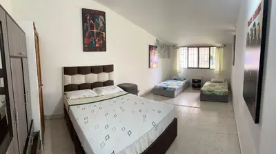 a bedroom with two beds in a room at villa juliana in Mariquita