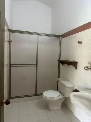a bathroom with a shower and a toilet and a sink at villa juliana in Mariquita