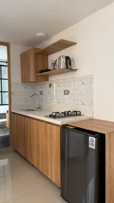 a kitchen with a sink and a stove top oven at Lunaria House - Laureles in Medellín