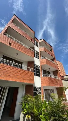 a brick building with balconies on the side of it at Lunaria House - Laureles in Medellín