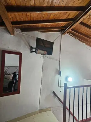 a room with a window and a mirror on the wall at Aparta estudio en Concepción in Concepción