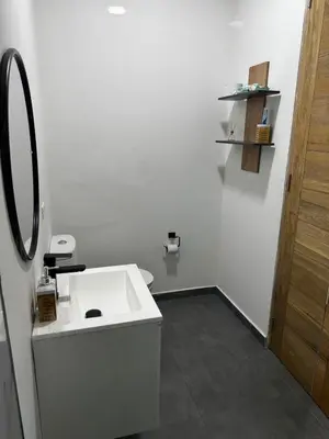 a white bathroom with a sink and a mirror at Luxury estate in San Jerónimo with infinity pool in San Jerónimo